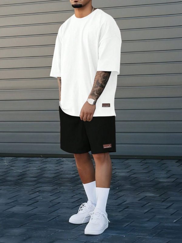 This Men's Athletic Casual Outfit Features A Simple And Loose Design With Red Color-Blocked Striped Lettering. It Includes A Round-Neck Short-Sleeve Black T-Shirt And Matching Shorts, Making It Perfect For Everyday Wear And Music Festivals. This Set Is An Ideal Gift For Boyfriends Or Husbands, Showcasing Thoughtfulness And Style. Men's Summer Casual Letter Print Short Sleeve T-Shirt And Shorts Set , Men Shorts Set Men T Shirt Co-Ord , Men Two Piece Short Sets ,Men Shorts Set ,Men Two Piece Outfi