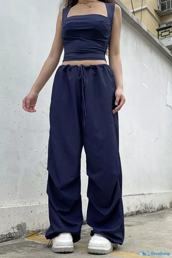 OrcaJump - Pantalones vaqueros de cintura baja con bolsillos de parche de color azul sólido para mujer